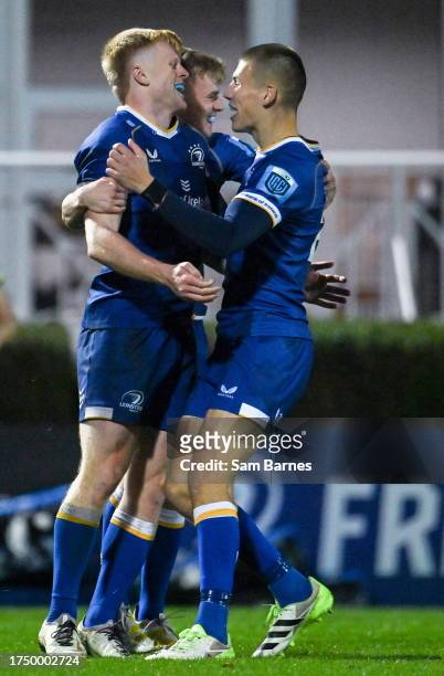 Dublin , Ireland - 28 October 2023; Tommy O'Brien of Leinster, left, celebrates with teammates Ben Murphy, centre, and Sam Prendergast, after scoring...