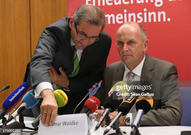 Brandenburg Governor and German Social Democrat Matthias Platzeck switsches name plates after trading seats with Brandenburg State Minister of the...