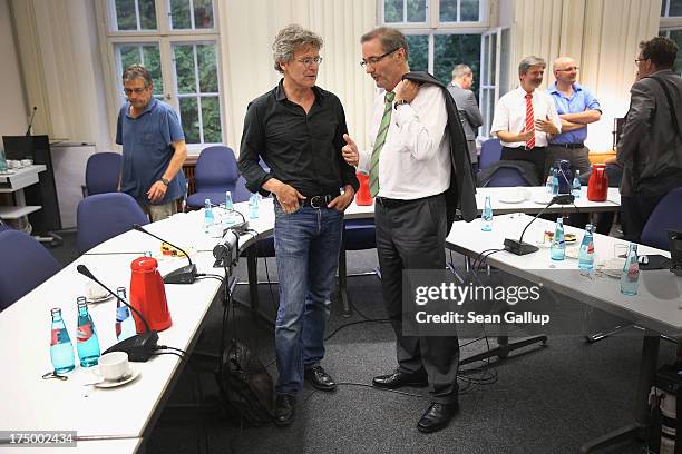 Brandenburg Governor and German Social Democrat Matthias Platzeck chats with a journalist after speaking to the media in which Platzeck announced his...