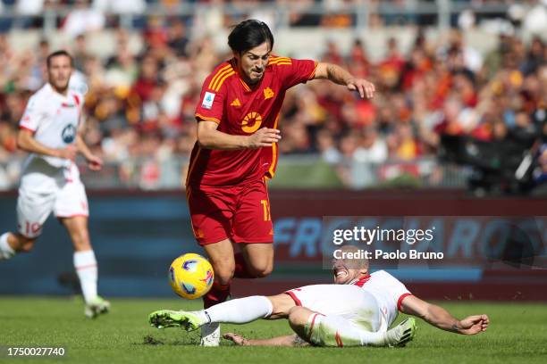 Sardar Azmoun of AS Roma is challenged by Luca Caldirola of AC Monza during the Serie A TIM match between AS Roma and AC Monza at Stadio Olimpico on...