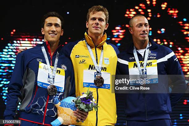 Silver medal winner Eugene Godsoe of the USA, Gold medal winner Cesar Cielo Filho of Brazil and bronze medal winner Frederick Bousquet of France...