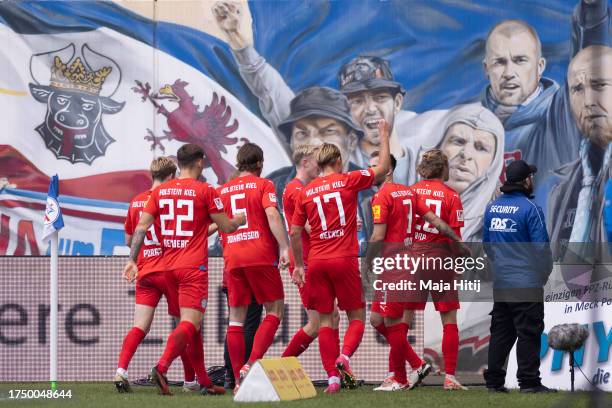 Fiete Arp of Holstein Kiel celebrates with team mates after scoring the team's first goal during the Second Bundesliga match between F.C. Hansa...