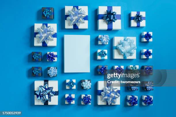 gift boxes on dark light blue blue background. - confetti light blue background stock pictures, royalty-free photos & images