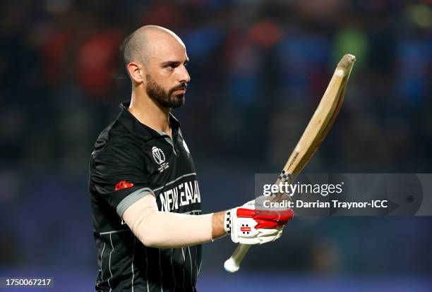 Daryl Mitchell of New Zealand acknowledges the fans after being dismissed during the ICC Men's Cricket World Cup India 2023 match between India and...