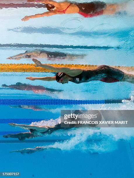 In a picture taken with an underwater camera US swimmer Jessica Hardy, US swimmer Breeja Larson, Jamaica's Alia Atkinson and Netherlands' Moniek...