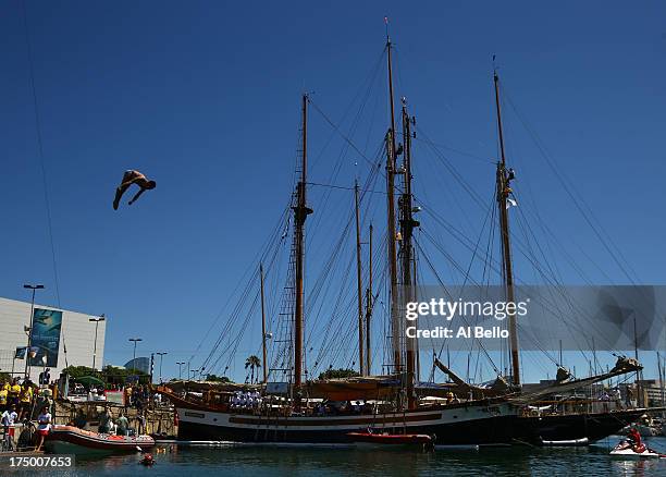 Blake Aldridge of Great Britain competes during the Men's 27m High Diving on day ten of the 15th FINA World Championships at Moll de la Fusta on July...