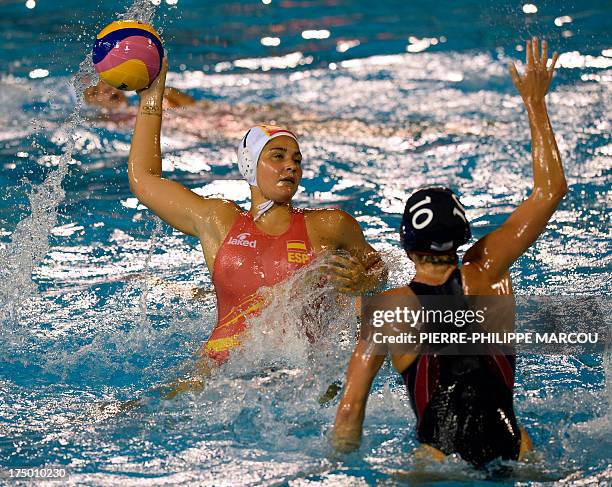 Spain's Lorena Miranda vies with US player Kelly Rulon during their women's water polo quarter-finals match at the FINA World Championships on July...