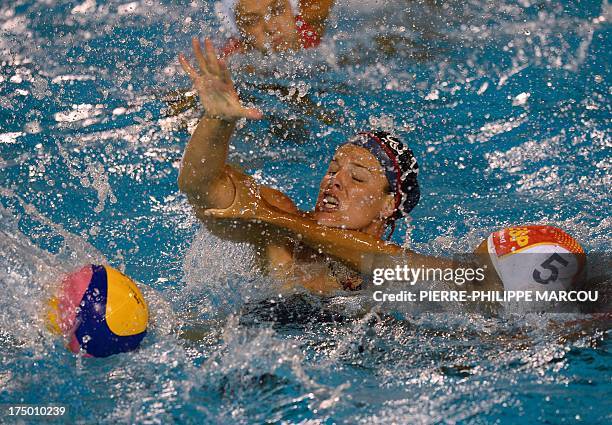 Spain's Matilde Ortiz vies with US player Kelly Rulon during their women's water polo quarter-finals match at the FINA World Championships on July...