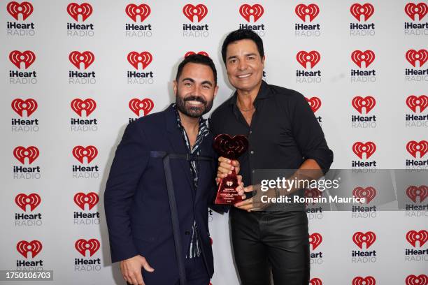 Enrique Santos and Chayanne attend 2023 iHeartRadio Fiesta Latina at Kaseya Center on October 21, 2023 in Miami, Florida.