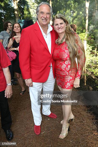 Stewart Lane and Bonnie Comley attend The 20th Annual Watermill Center Summer Benefit at The Watermill Center on July 27, 2013 in Water Mill, New...