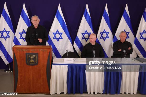 Israeli Prime Minister Benjamin Netanyahu , Defence Minister Yoav Gallant and Cabinet Minister Benny Gantz hold a press conference in the Kirya...