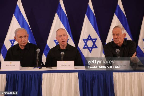 Israeli Prime Minister Benjamin Netanyahu , Defence Minister Yoav Gallant and Cabinet Minister Benny Gantz hold a press conference in the Kirya...