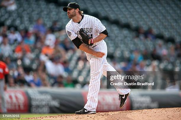 Mitchell Boggs of the Colorado Rockies pitches against the Miami Marlins during a game at Coors Field on July 25, 2013 in Denver, Colorado. The...