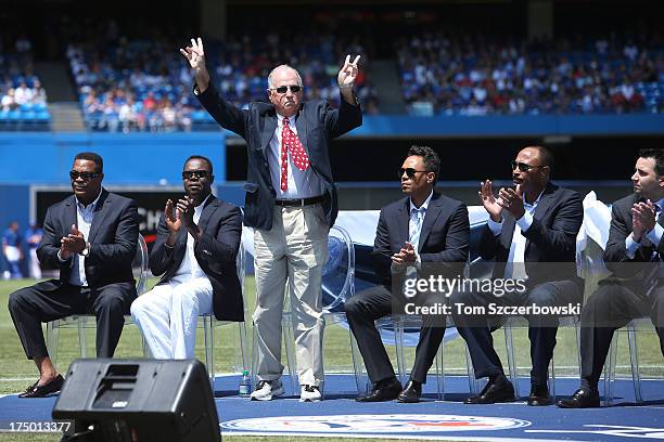 Former general manager Pat Gillick acknowledges the crowd as he is introduced during a pre-game ceremony for former player Carlos Delgado of the...