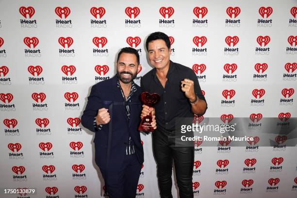 Enrique Santos and Chayanne attend 2023 iHeartRadio Fiesta Latina at Kaseya Center on October 21, 2023 in Miami, Florida.