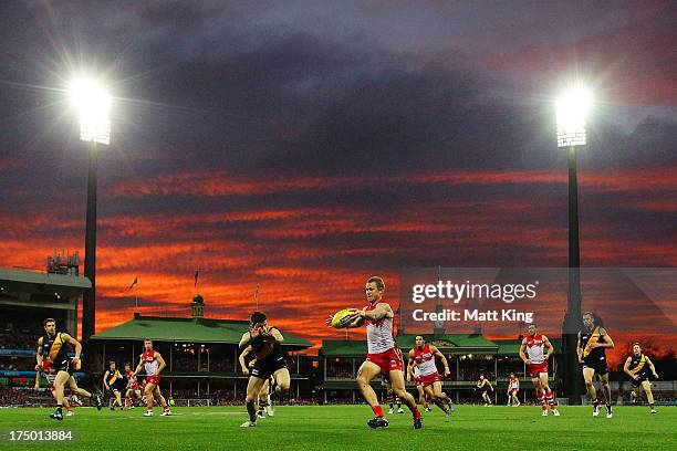 Ryan O'Keefe of the Swans clears the ball during the round 18 AFL match between the Sydney Swans and the Richmond Tigers at SCG on July 28, 2013 in...