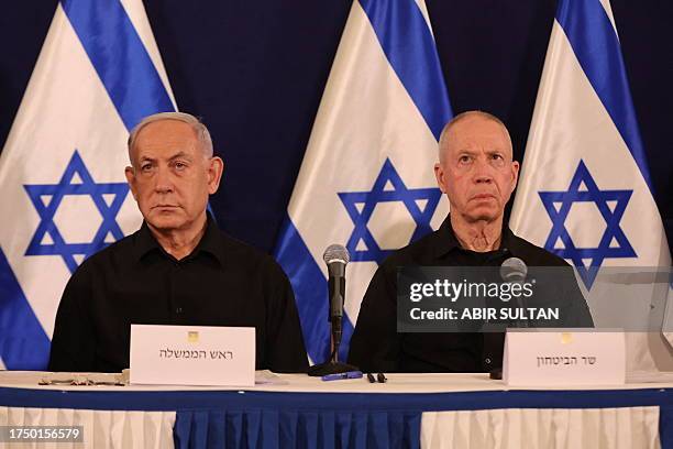 Israeli Prime Minister Benjamin Netanyahu and Defence Minister Yoav Gallant attend a press conference in the Kirya military base in Tel Aviv on...