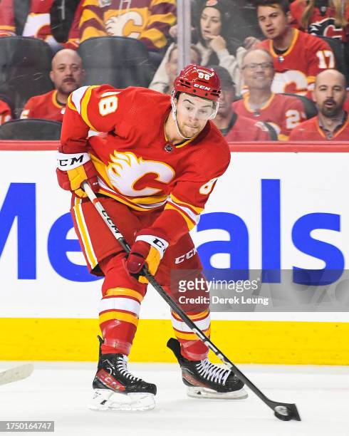 Andrew Mangiapane of the Calgary Flames in action against the Winnipeg Jets during an NHL game at Scotiabank Saddledome on October11, 2023 in...