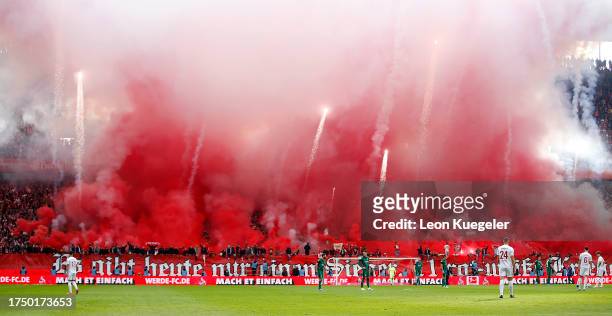 General view inside the stadium as fans of 1. FC Koln use pyrotechnics prior to kick-off ahead of the Bundesliga match between 1. FC Köln and...