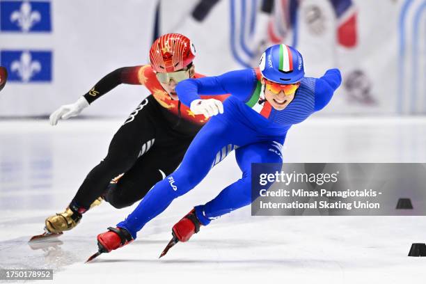 Pietro Sighel of Italy skates ahead of Lin Xiaojun of China in the men's 500 m semifinal during the ISU World Cup Short Track at Maurice Richard...