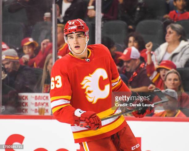 Adam Ruzicka of the Calgary Flames in action against the Winnipeg Jets during an NHL game at Scotiabank Saddledome on October11, 2023 in Calgary,...