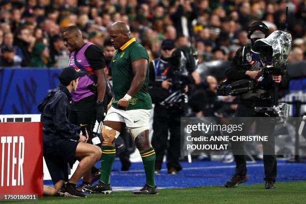 South Africa's hooker Bongi Mbonambi leaves the field after being injured during the France 2023 Rugby World Cup Final match between New Zealand and...