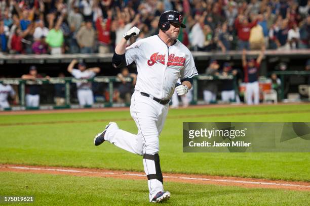 Jason Giambi of the Cleveland Indians celebrates after hitting a walk of solo home run in the bottom of the ninth inning against the Chicago White...