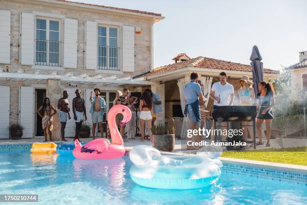 fun pool party at a beautiful istrian villa - garden party stock pictures, royalty-free photos & images