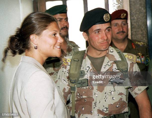 Jordan's Crown Prince Hamzah ibn al-Hussein accompanies his Swedish counterpart, Princess Victoria, upon her departure at Amman airport 29 April...