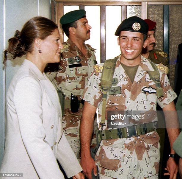 Jordan's Crown Prince Hamzah ibn al-Hussein accompanies his Swedish counterpart, Princess Victoria, upon her departure at Amman airport 29 April...
