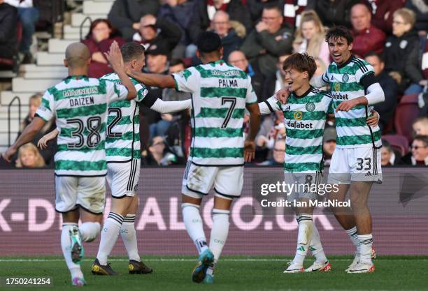 Kyogo Furuhashi of Celtic celebrates scoring his team's third goal during the Cinch Scottish Premiership match between Heart of Midlothian and Celtic...