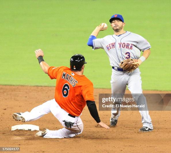 Miami Marlins' Jeff Mathis is out at second base, as New York Mets ...