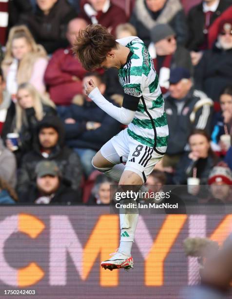 Kyogo Furuhashi of Celtic celebrates scoring his team's third goal during the Cinch Scottish Premiership match between Heart of Midlothian and Celtic...