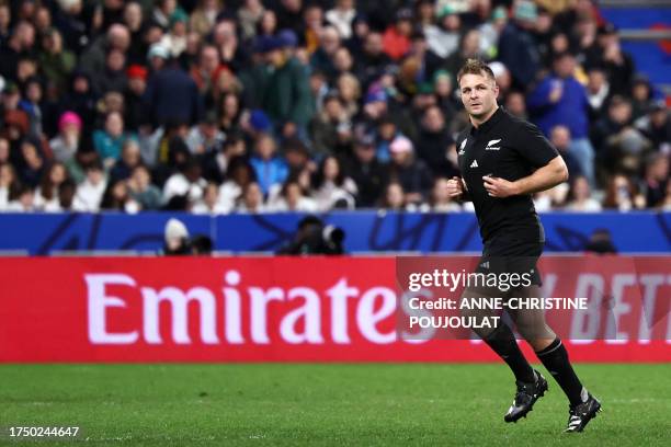 New Zealand's openside flanker and captain Sam Cane leaves the field after receiving a yellow card during the France 2023 Rugby World Cup Final match...