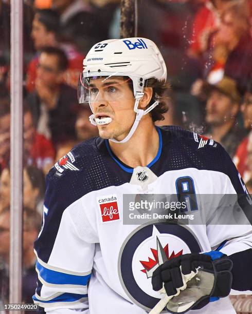 Mark Scheifele of the Winnipeg Jets in action against the Calgary Flames during an NHL game at Scotiabank Saddledome on October 11, 2023 in Calgary,...