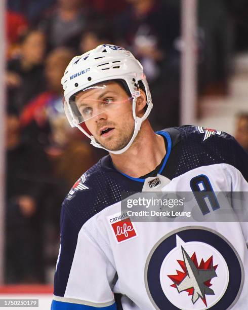 Josh Morrissey of the Winnipeg Jets in action against the Calgary Flames during an NHL game at Scotiabank Saddledome on October 11, 2023 in Calgary,...