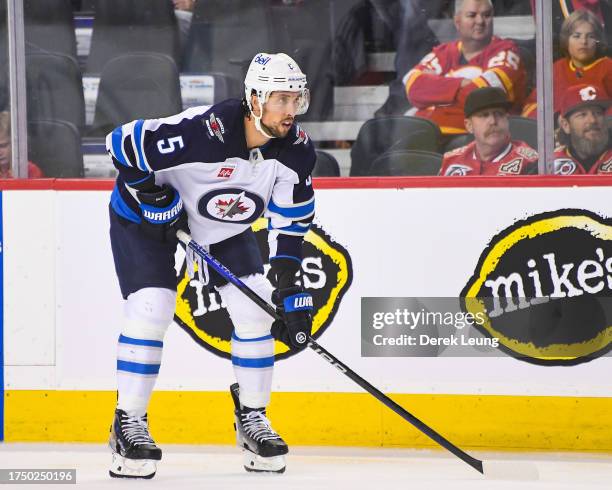 Brenden Dillon of the Winnipeg Jets in action against the Calgary Flames during an NHL game at Scotiabank Saddledome on October 11, 2023 in Calgary,...