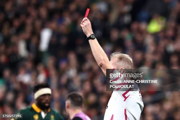 English referee Wayne Barnes shows a red card to New Zealand's openside flanker and captain Sam Cane during the France 2023 Rugby World Cup Final...