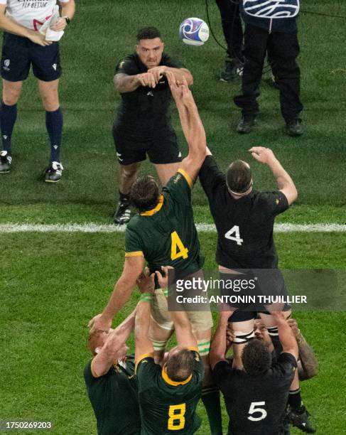 New Zealand's hooker Codie Taylor throws the ball into a lineout during the France 2023 Rugby World Cup Final between New Zealand and South Africa at...