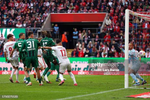 Nico Elvedi of Borussia Moenchengladbach scores the team's first goal to equalise during the Bundesliga match between 1. FC Köln and Borussia...