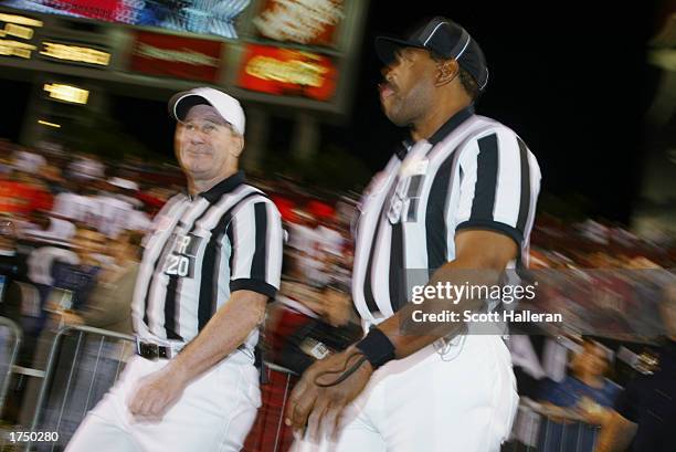 Referee Larry Nemmers and Umpire Chad Brown walk on the field during the game between the Tampa Bay Buccaneers and the Pittsburgh Steelers on...