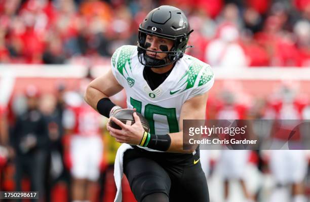 Bo Nix of the Oregon Ducks rushes for a touchdown against the Utah Utes during the first half of their game at Rice Eccles Stadium on October 28,...