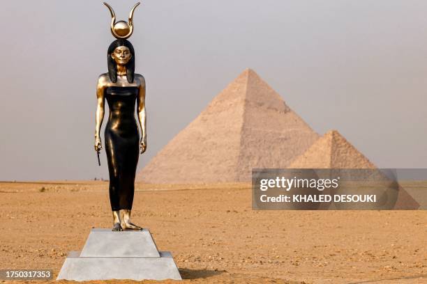 The art installation "Egyptian Woman in the Form of the Goddess Hathor" by US artist Carole Feuerman is pictured during the third edition of the...