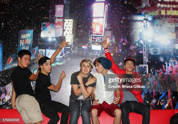 Will Jay, Gabe Morales, Dalton Rapattoni, Cole Pendery and Dana Vaughns of the group IM5 visit Planet Hollywood Times Square on July 29, 2013 in New...