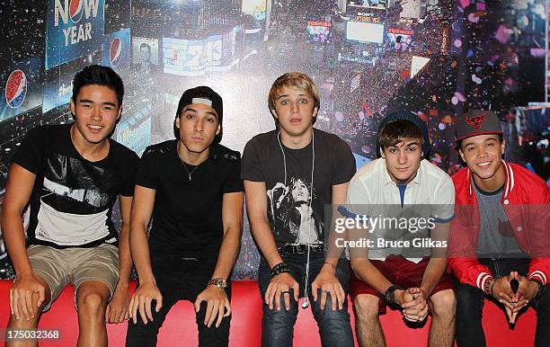 Will Jay, Gabe Morales, Dalton Rapattoni, Cole Pendery and Dana Vaughns of the group IM5 visit Planet Hollywood Times Square on July 29, 2013 in New...