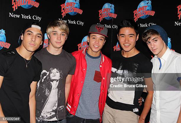 Gabe Morales, Dalton Rapattoni, Dana Vaughns, Cole Pendery and Will Jay of the group IM5 visit Planet Hollywood Times Square on July 29, 2013 in New...