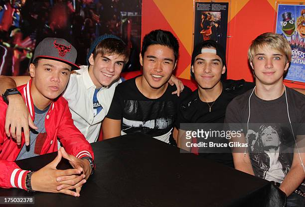 Dana Vaughns, Cole Pendery, Will Jay, Gabe Morales and Dalton Rapattoni of the group IM5 visit Planet Hollywood Times Square on July 29, 2013 in New...
