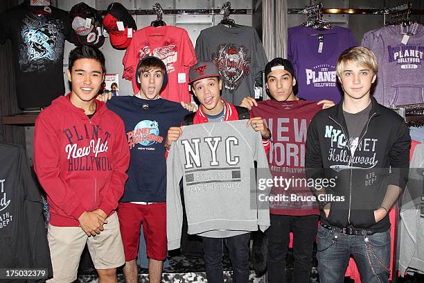 Will Jay, Cole Pendery, Dana Vaughns, Gabe Morales and Dalton Rapattoni of the group IM5 visit Planet Hollywood Times Square on July 29, 2013 in New...