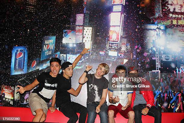 Will Jay, Gabe Morales, Dalton Rapattoni, Cole Pendery and Dana Vaughns of the group IM5 visit Planet Hollywood Times Square on July 29, 2013 in New...