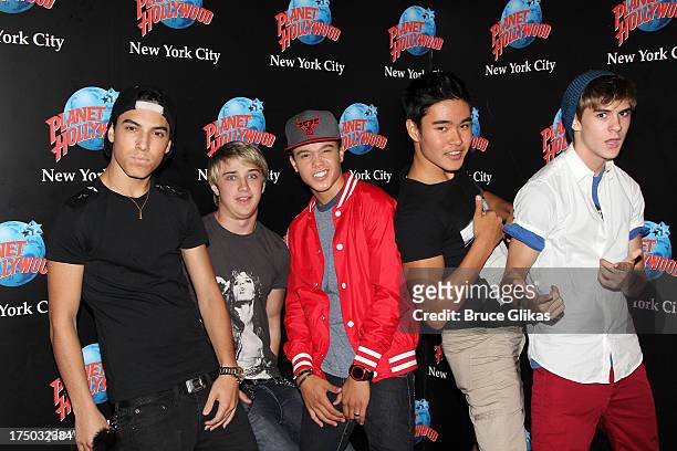 Gabe Morales, Dalton Rapattoni, Dana Vaughns, Cole Pendery and Will Jay of the group IM5 visit Planet Hollywood Times Square on July 29, 2013 in New...